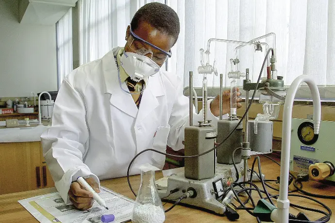 man inside laboratory experiments and write down the details